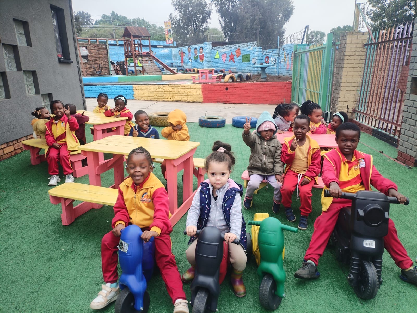 Children enjoying outdoor play at Rainbow Kiddies Daycare